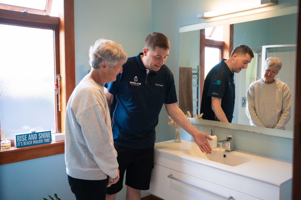 Wall-hung vanity and easy-clean finishes in a newly renovated bathroom